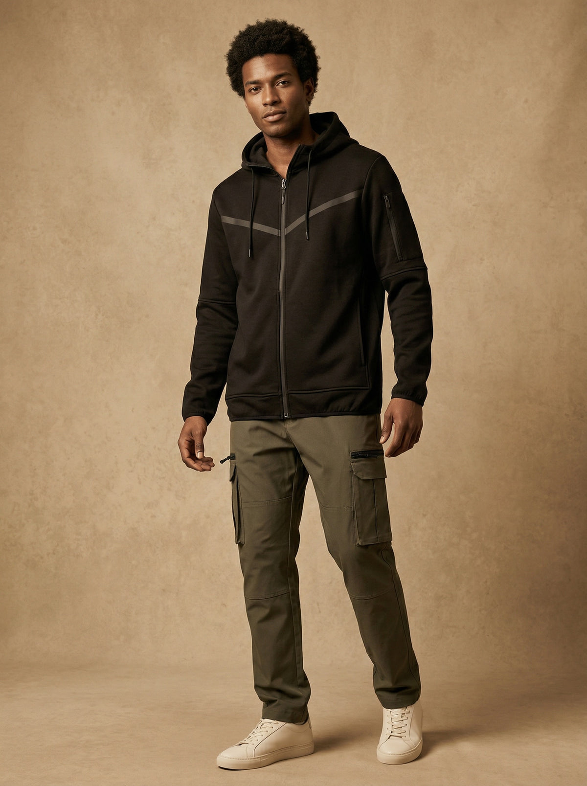 Man wearing the black solid tech fleece zip-up hoodie