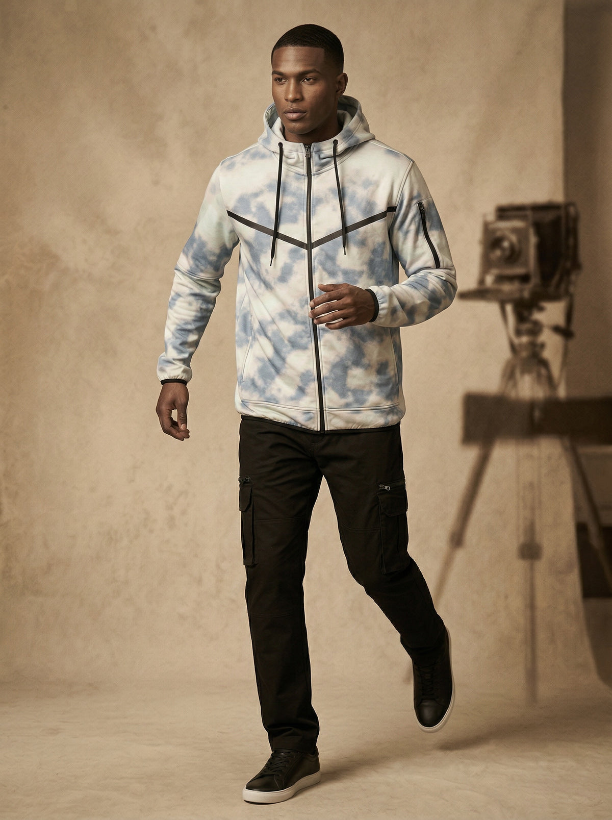 Man wearing the sky print tech fleece zip-up hoodie