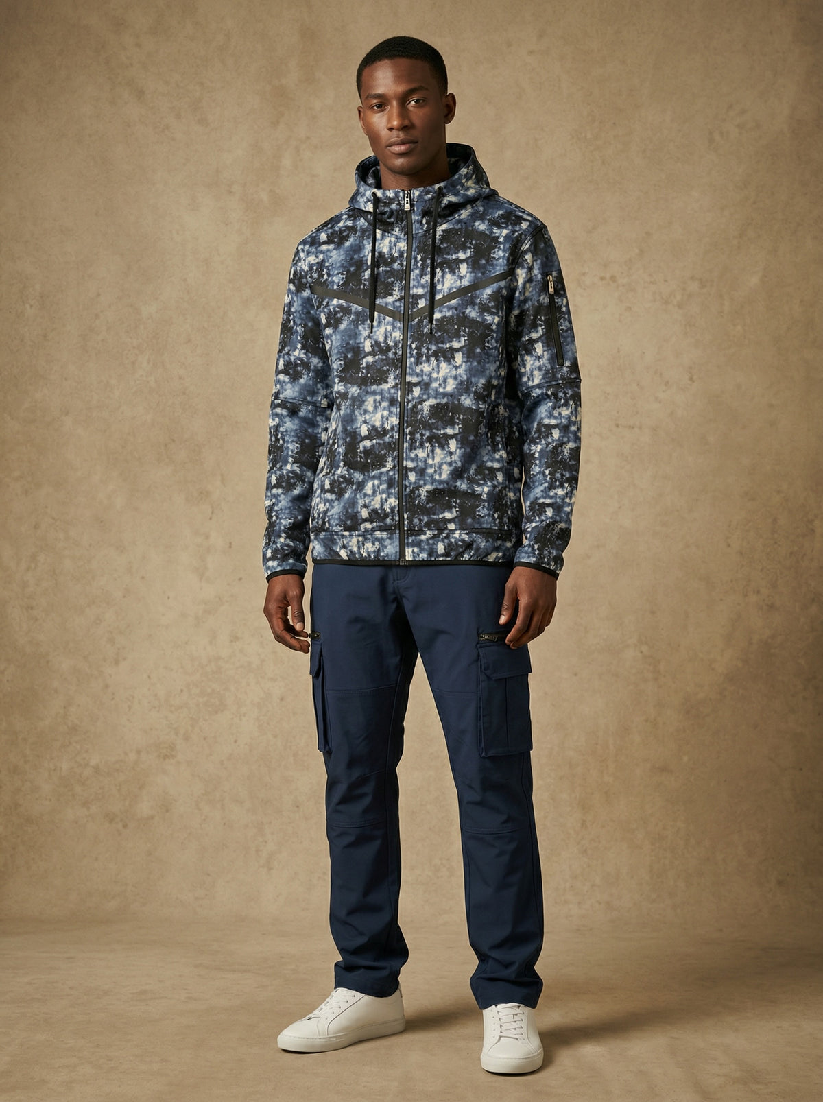 Man wearing the space print tech fleece zip-up hoodie